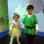 A boy and girl dressed as peter pan
